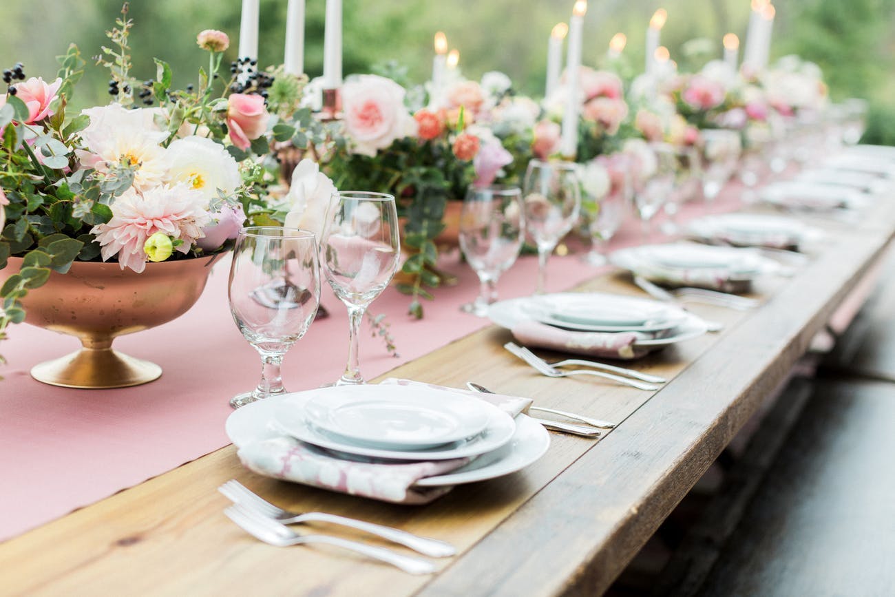 Rustic Wood Table with Pink and White Floral Centerpiece