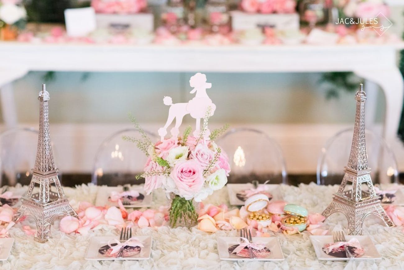 Stunning Table with Mini Eiffel Towers, Pink Poodles, and White Flowers