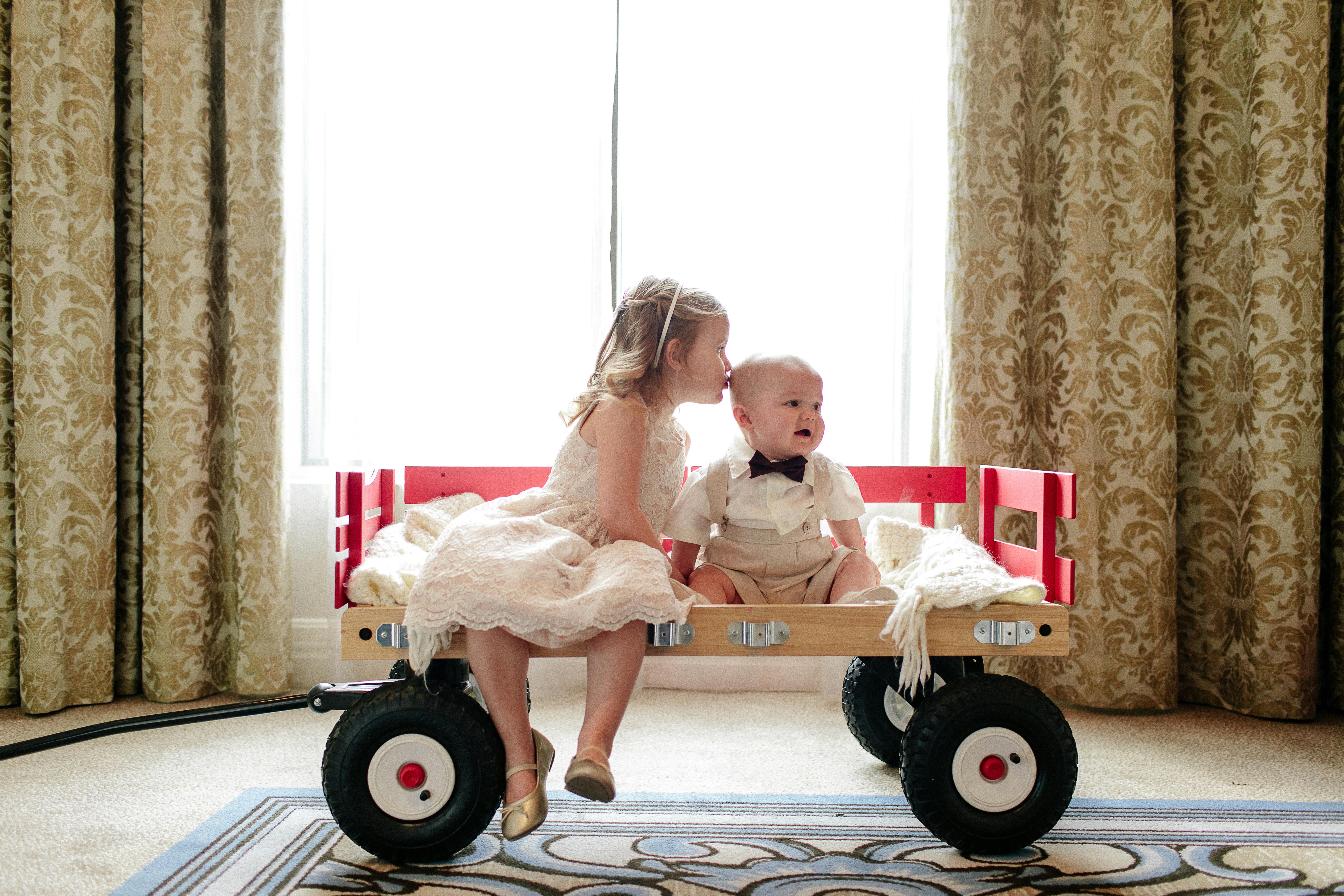 Two Kids Ride in Wagon for a Unique Wedding Ceremony Idea | PartySlate