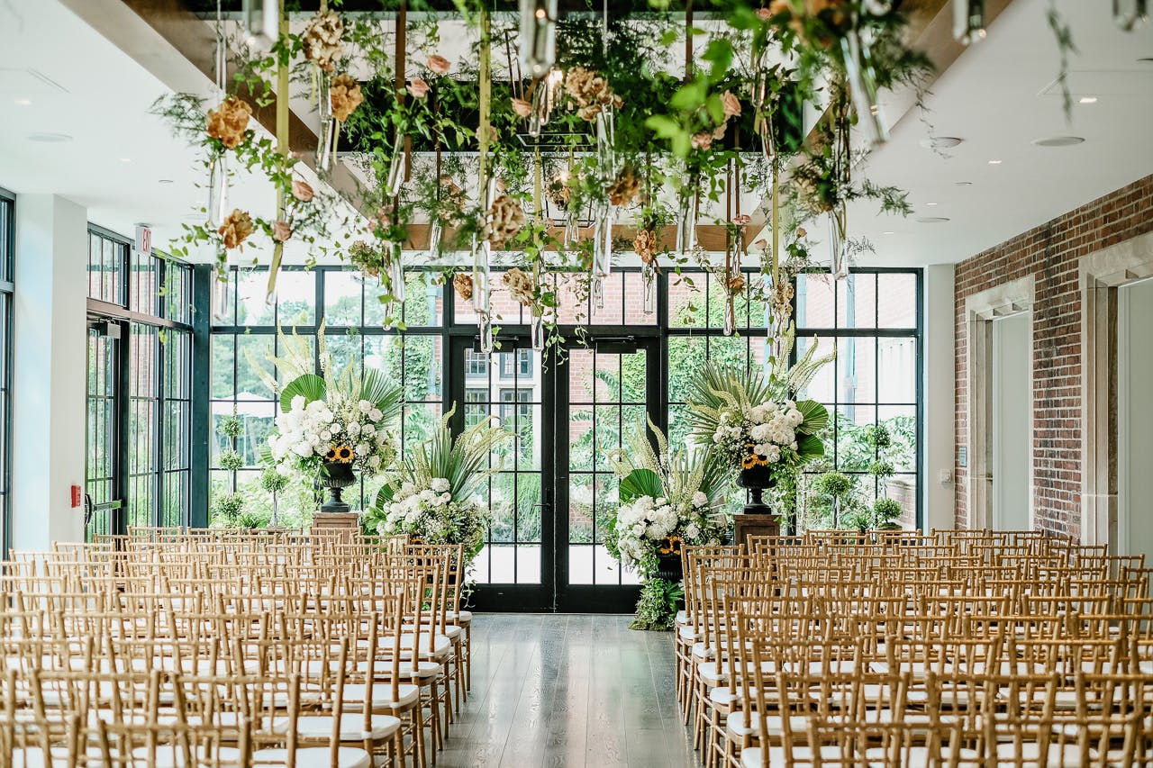 Unique Floral Installation Over Wedding Ceremony Aisle | PartySlate