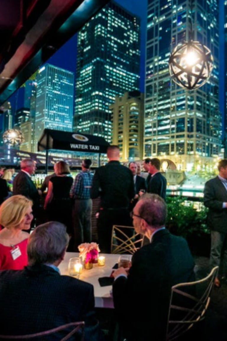 Private event with a blue city skyline at the River Roast Social House along the Chicago River | PartySlate