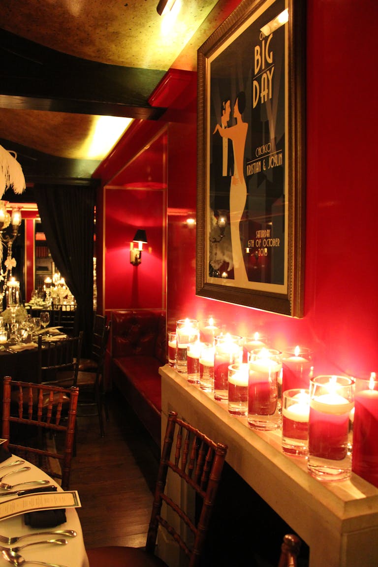 Art Deco style rehearsal Dinner with red candle lighting at Tortoise Supper Club in Chicago, IL | PartySlate