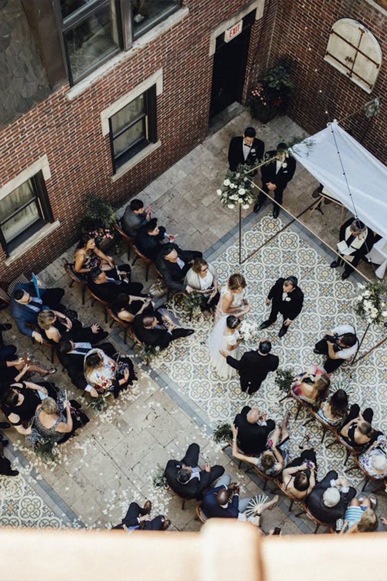 Overhead shot of Courtyard wedding at La Storia Ristorante in Chicago | PartySlate
