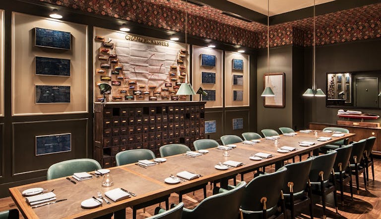 Somerset in Chicago private dining room with long wood table and blue chairs | PartySlate
