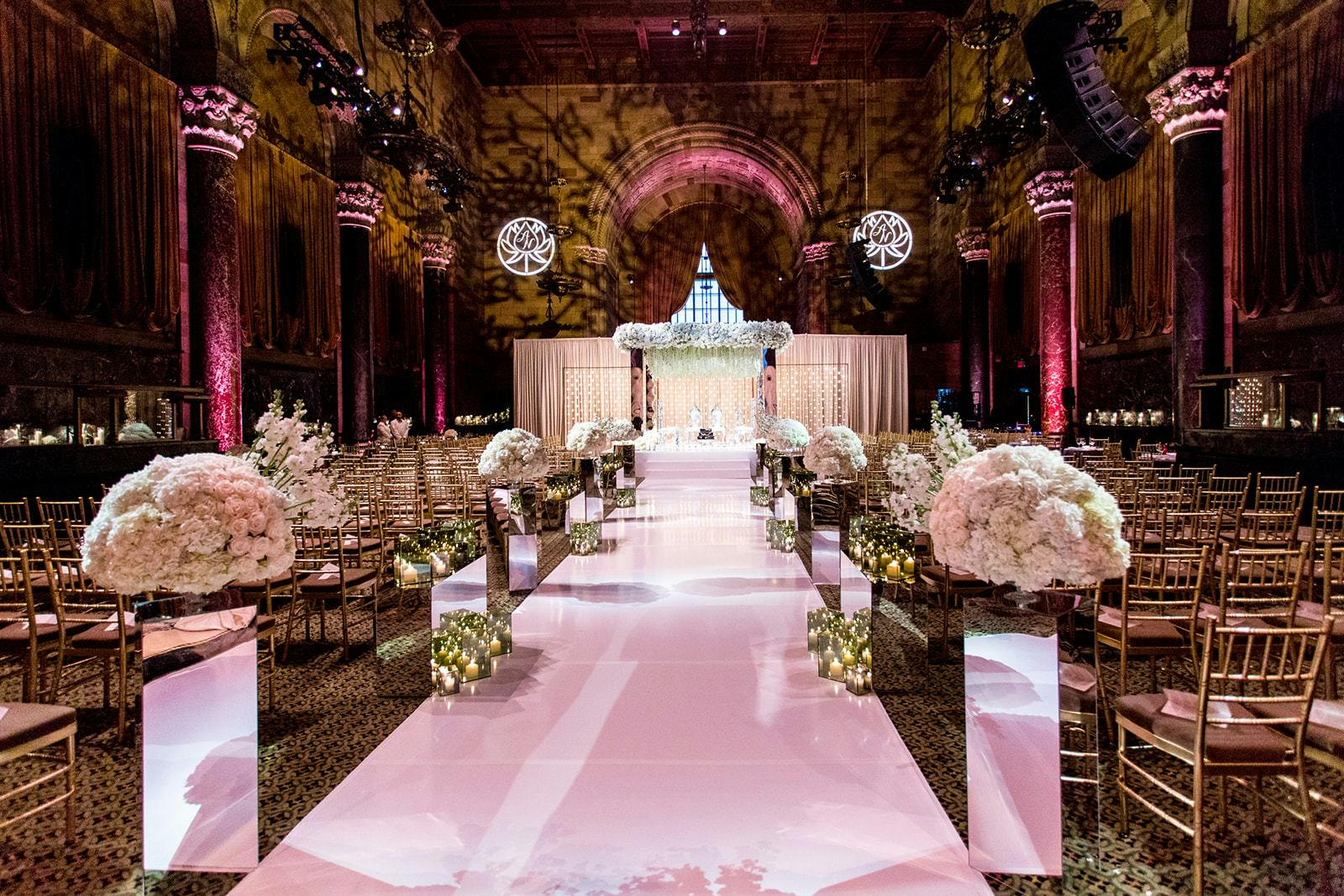 Glamorous white wedding with pink lighting at Cipriani | PartySlate