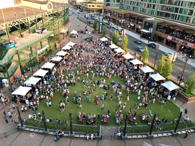 Crowded green plaza next to Wrigley Field, Chicago | PartySlate
