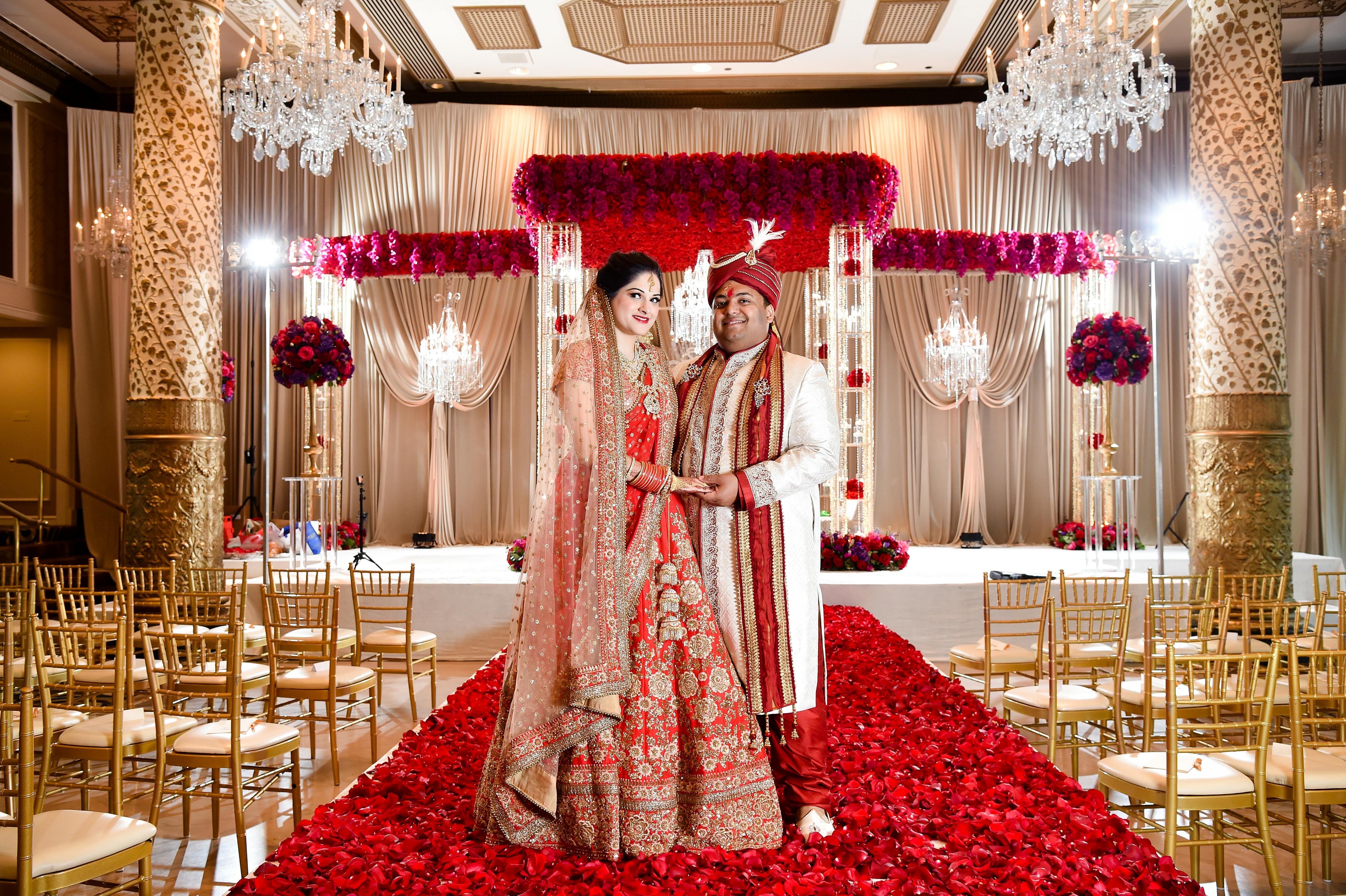 Rose-covered wedding aisle décor at Southeast Asian Wedding at the Hilton Chicago | PartySlate