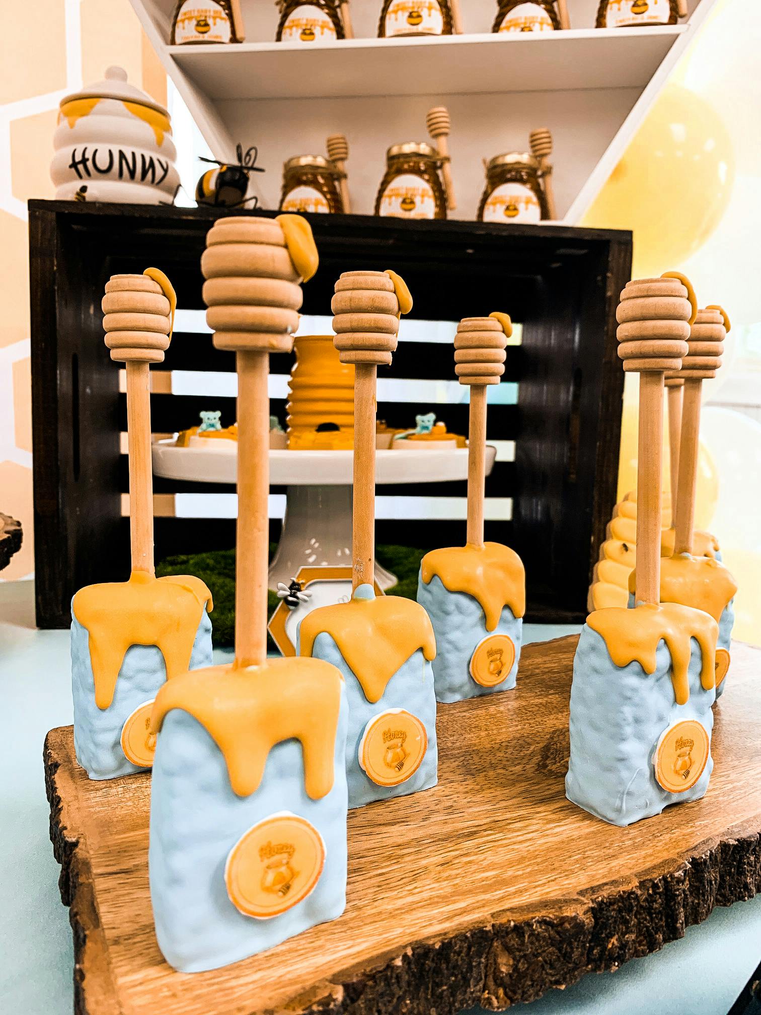 rice krispy treats with bee theme details served on honey dripper | PartySlate