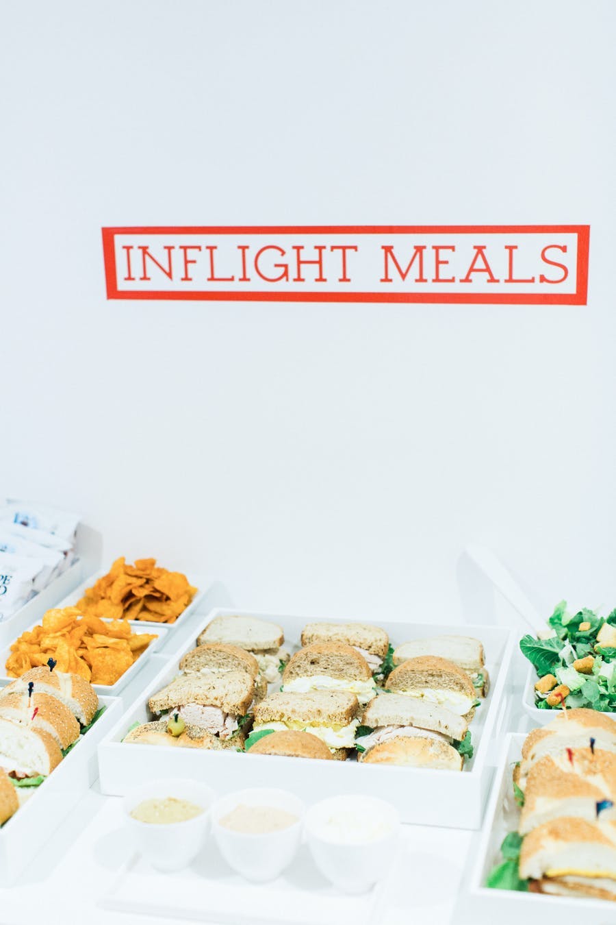 Sandwich display with an inflight meals label | PartySlate