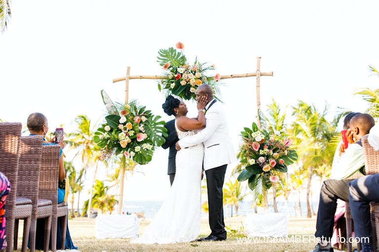 Bride and grooms first kiss | PartySlate