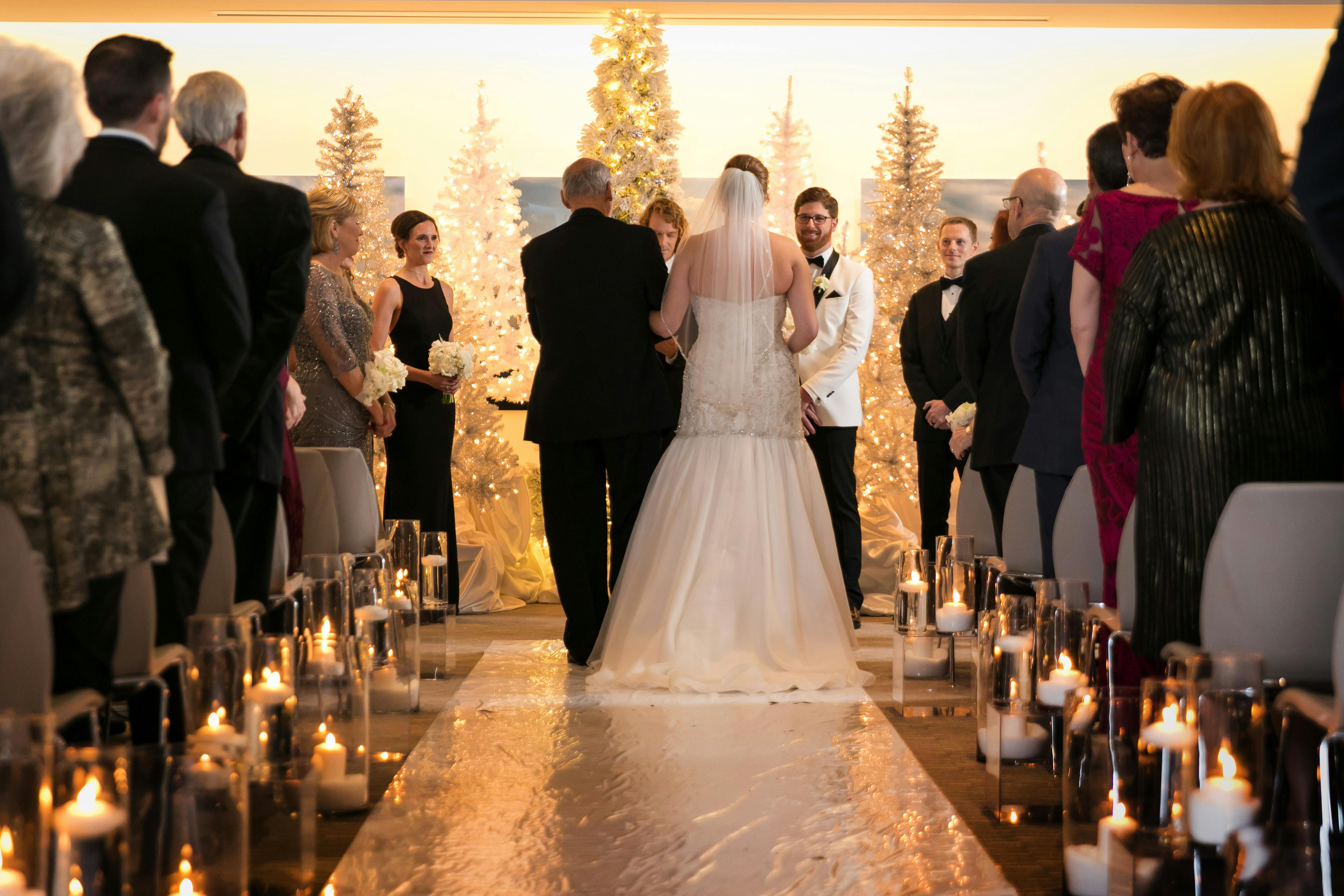 Winter wedding with silver foil wedding aisle décor | PartySlate