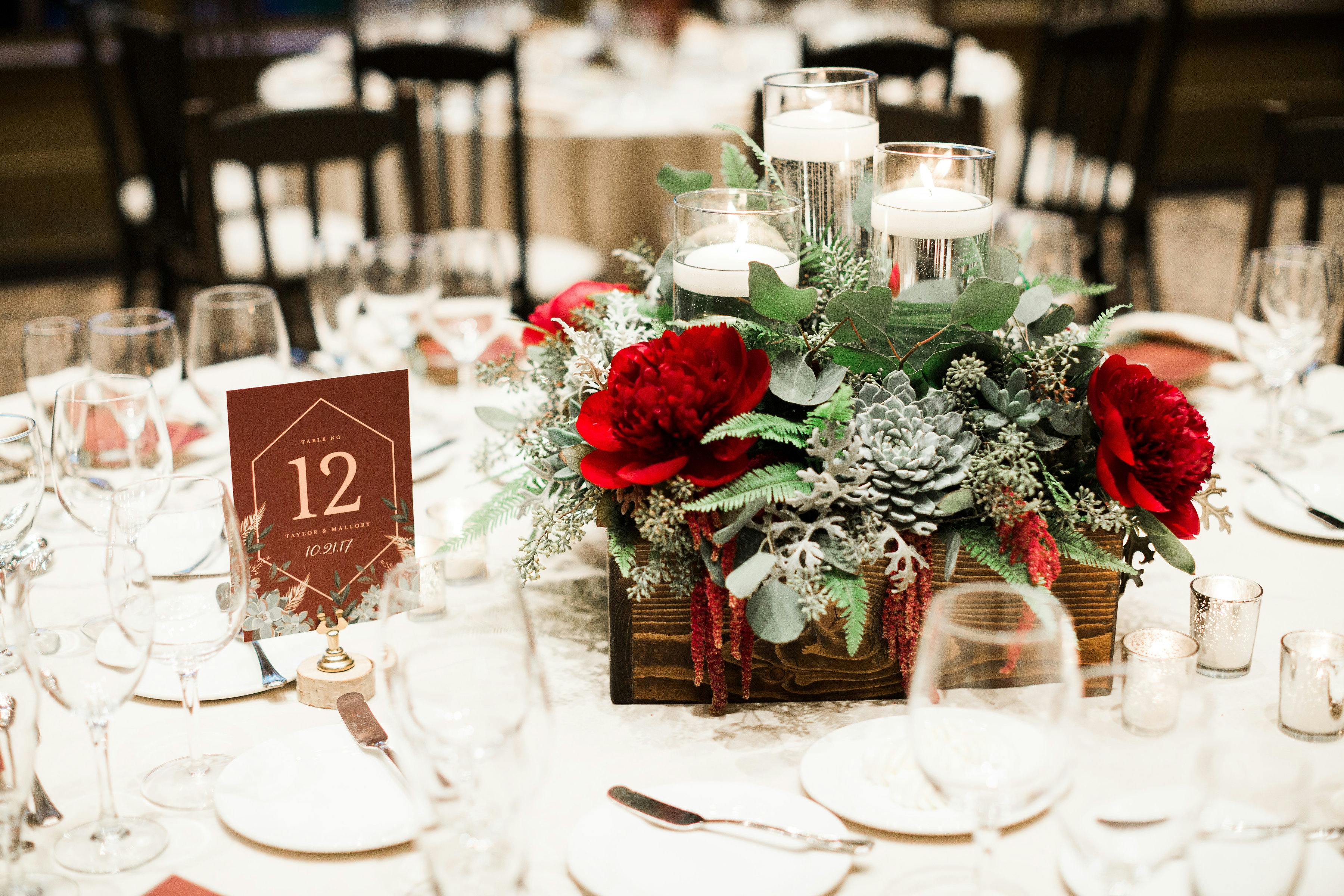Wedding Centerpiece With Succulents and Red Blooms