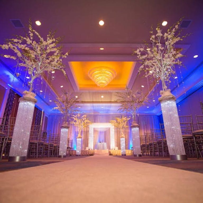 Dazzling San Francisco Wedding Venue with large aisle floral arrangements | PartySlate