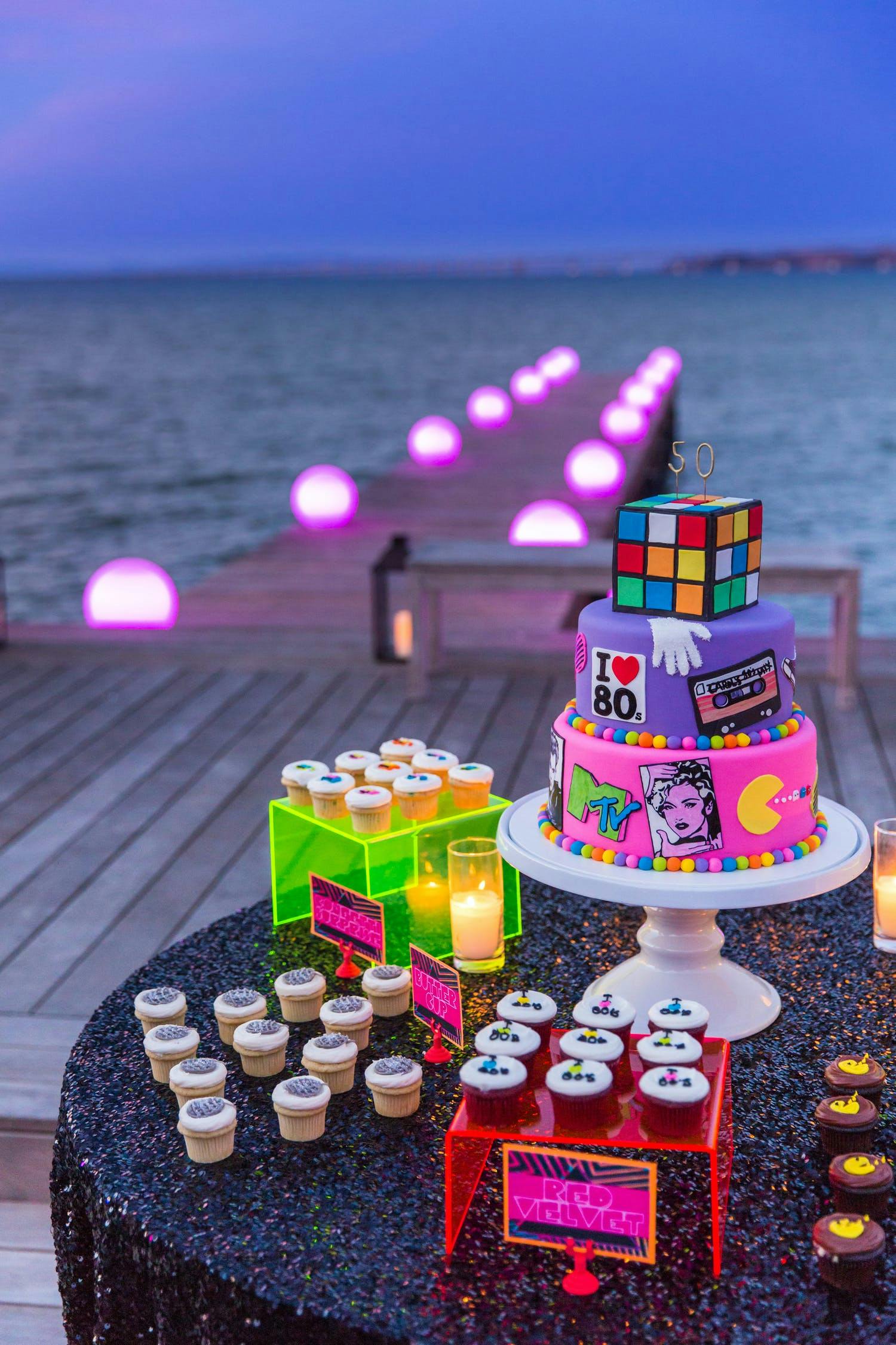 Rubik's cube topped cake with pac man theme cupcakes 2021 trend | PartySlate