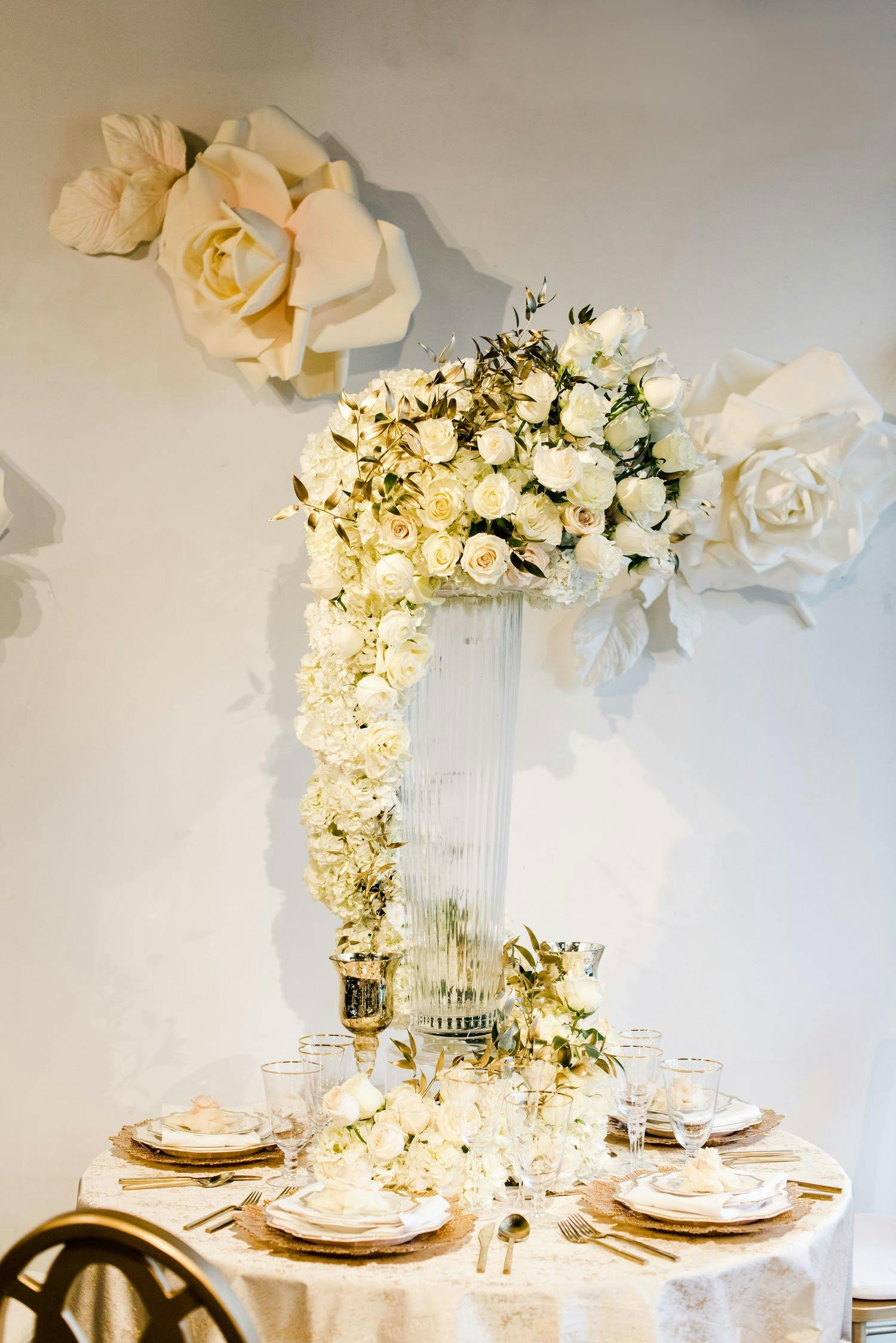 Overflowing white flower bouquet as centerpiece | PartySlate
