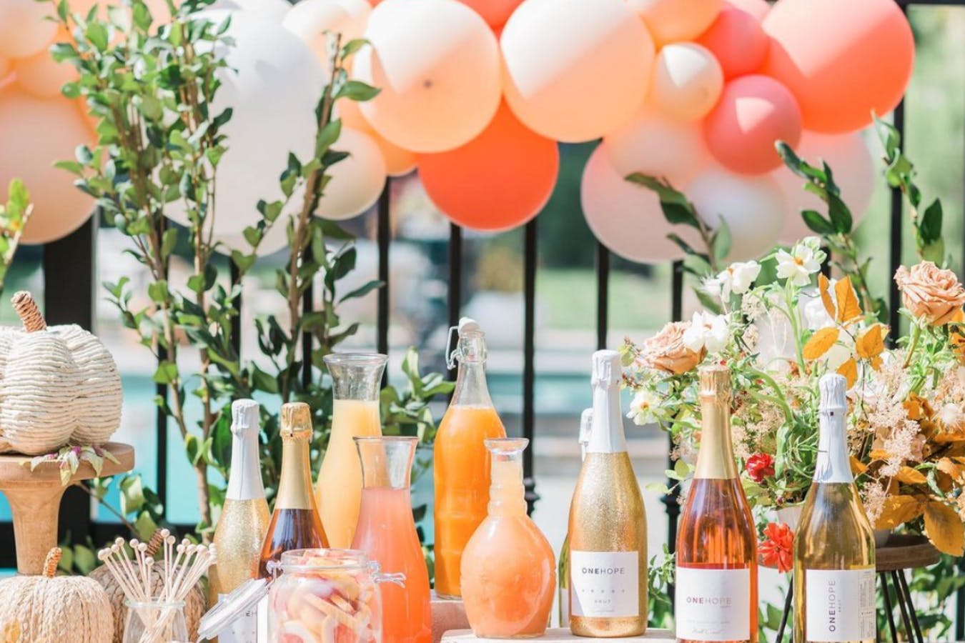 Mimosa Station in Peach Color Palette With Matching Balloon Décor | PartySlate