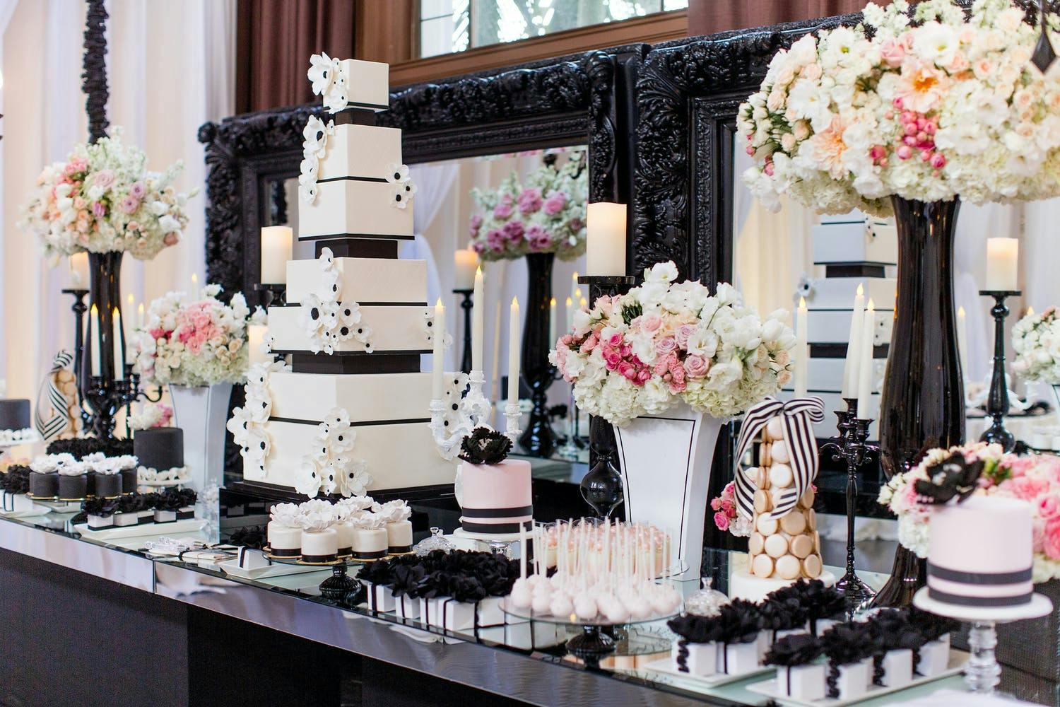 Black and White Wedding Cake and Other Dessert With Pink Floral Décor | PartySlate