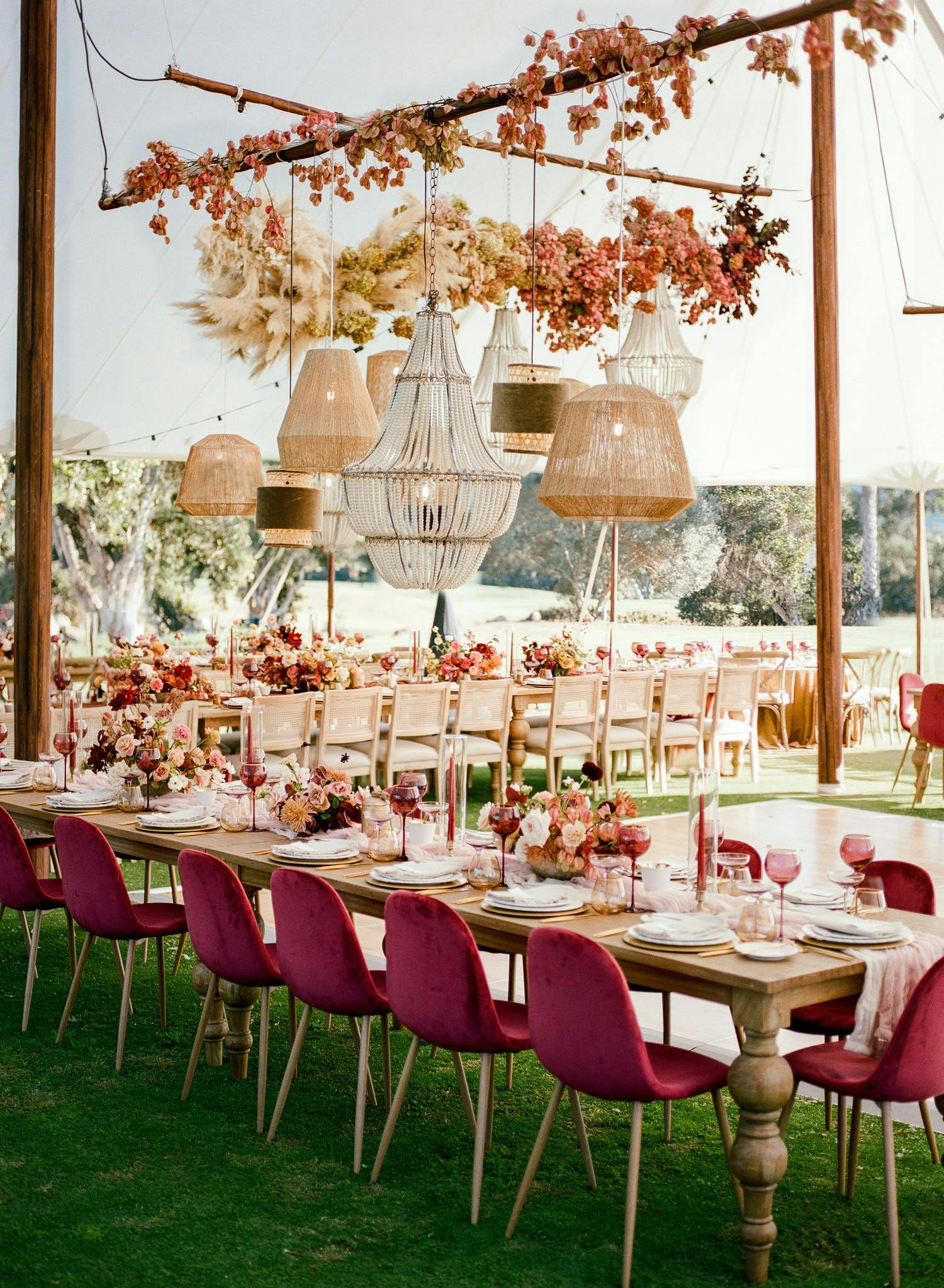 Rustic floral wedding with draping chandeliers and berry decal | PartySlate