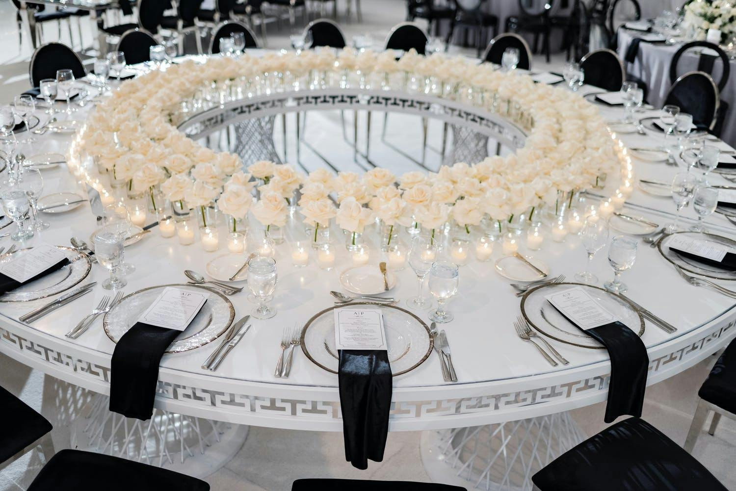 Torus-Shaped Wedding Reception Table With Black and White Wedding Décor | PartySlate