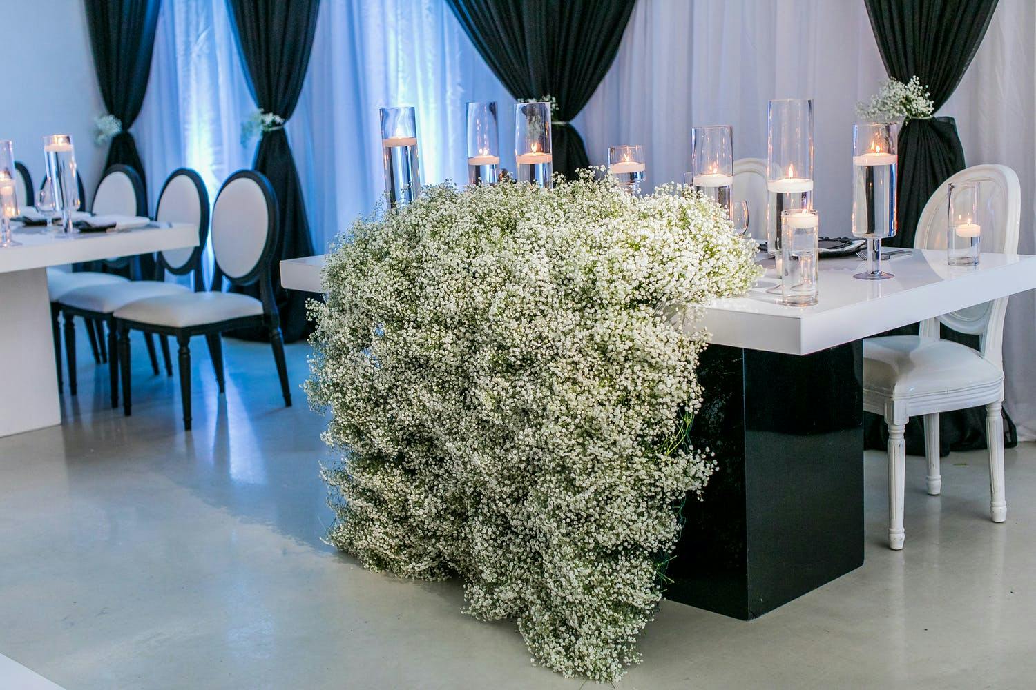 Black and White Wedding with Baby's Breath Cascading Off Sweetheart Table | PartySlate