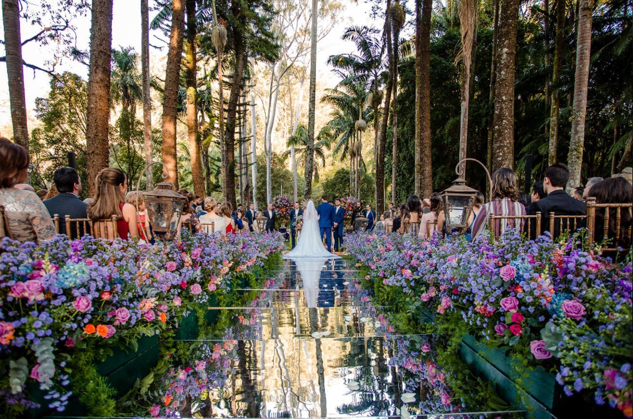Stunning outdoor wedding with a beautiful aisle | PartySlate