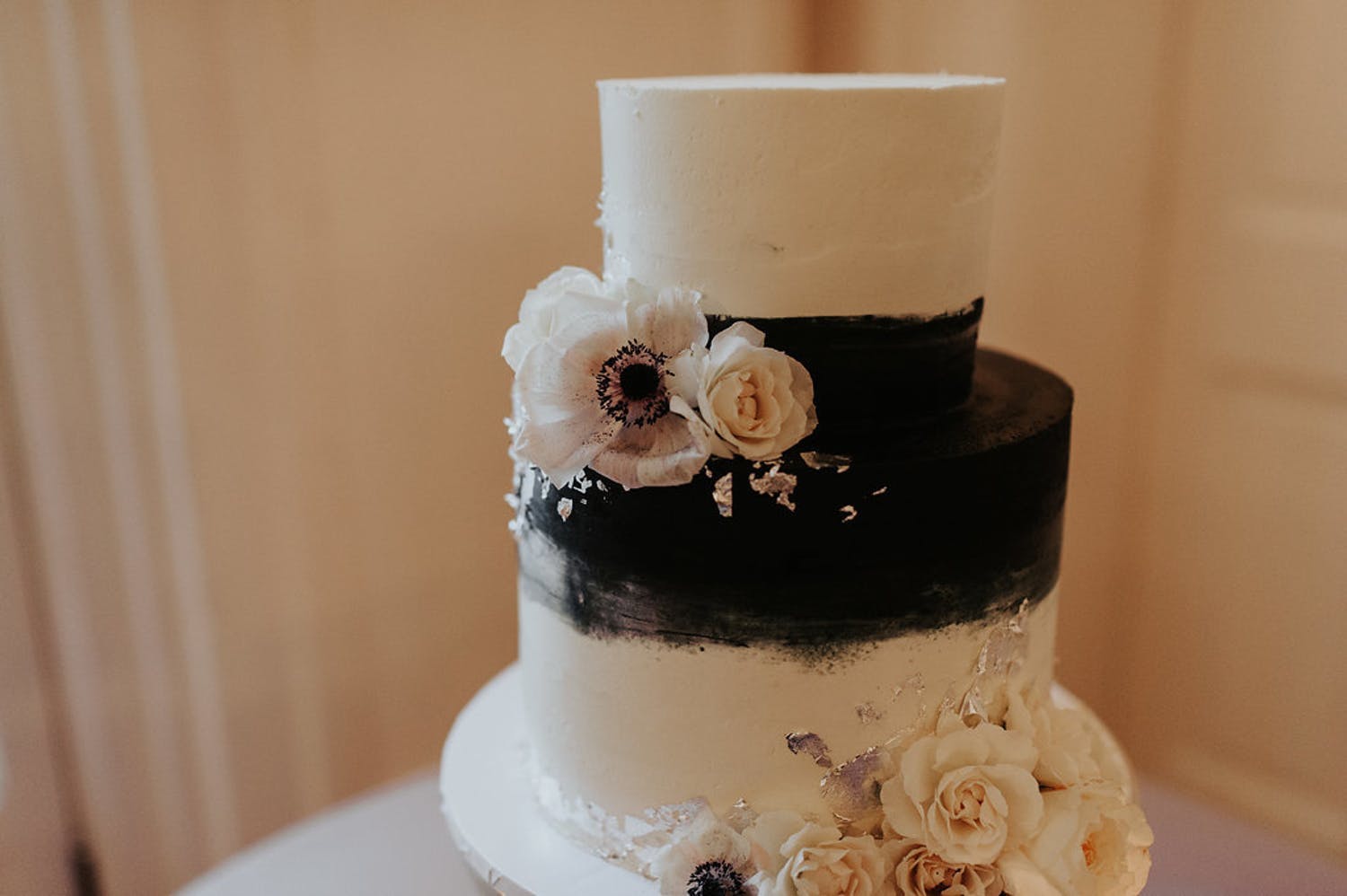 Black and White Wedding Cake With Blush-Toned Blooms | PartySlate