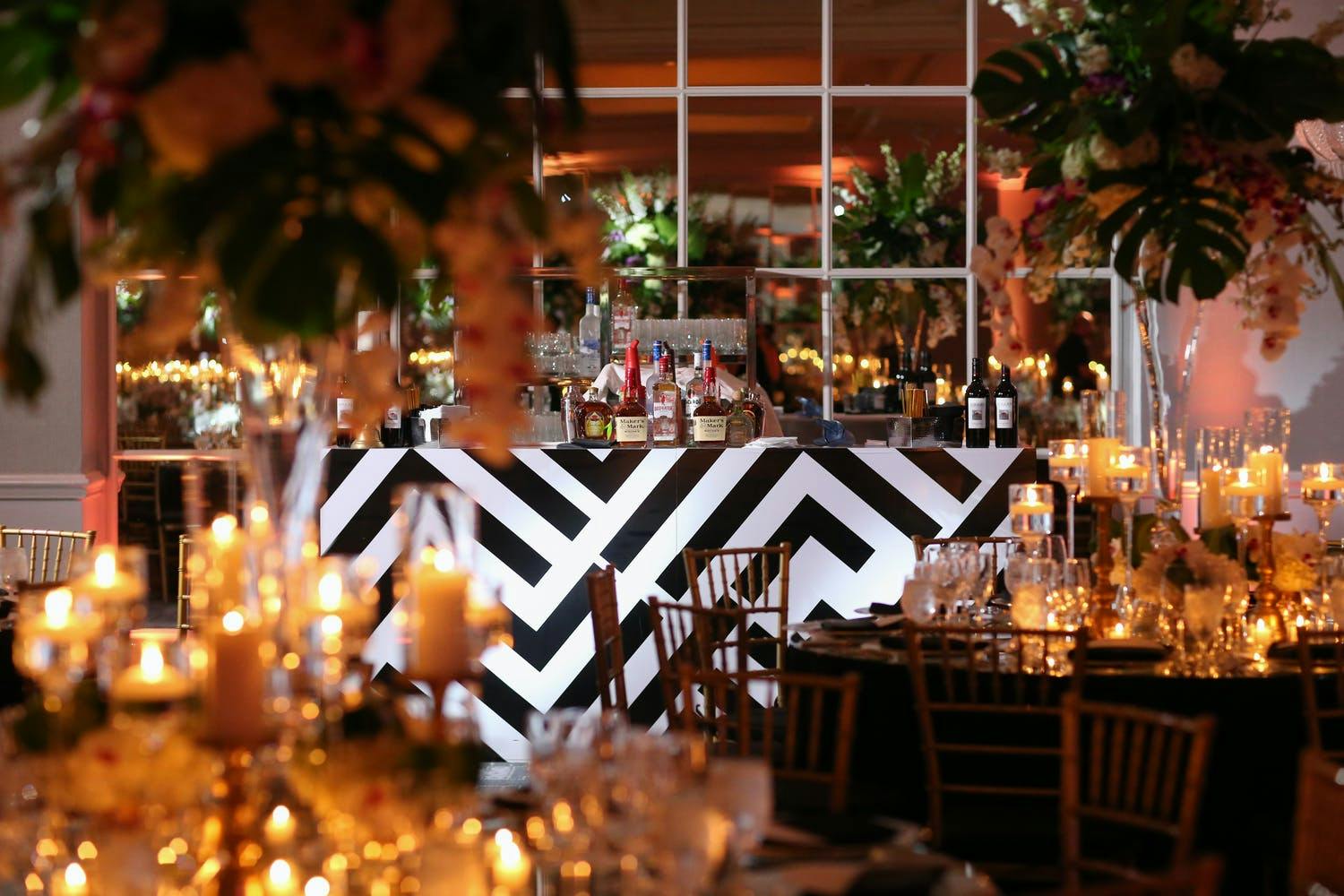 Wedding Reception With Black and White Art Deco-Style Bar Area and Tropical Décor | PartySlate