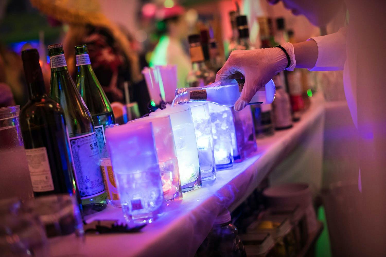 Glow-in-the-Dark Cocktails at Mad Hatter-Themed Party | PartySlate