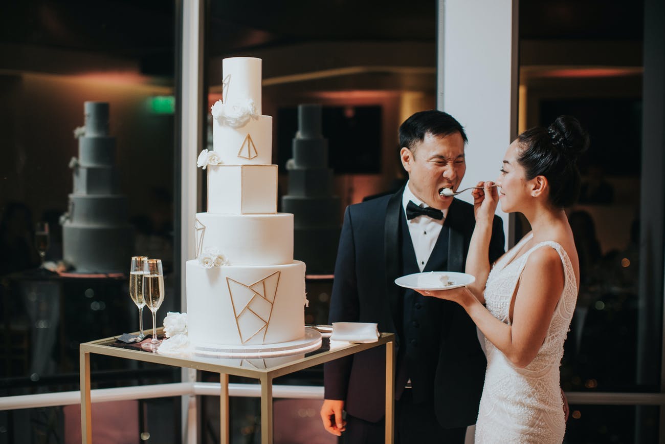 White wedding cake with shapes as the design | PartySlate