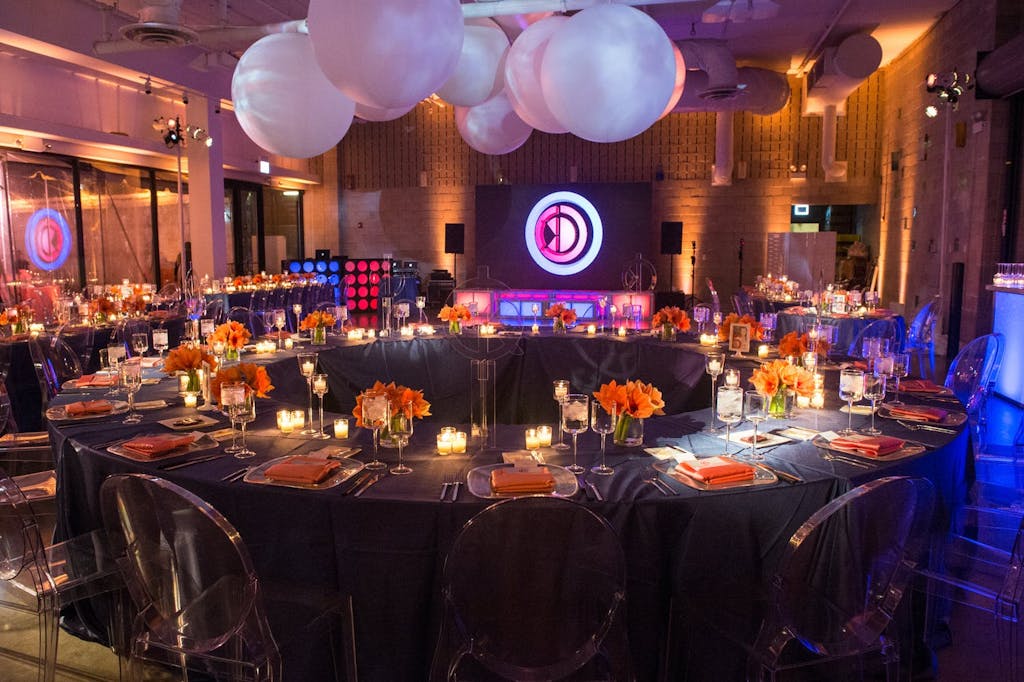 Torus-Shaped Table With Pink Balloon Ceiling Décor at Bat Mitzvah Party | PartySlate
