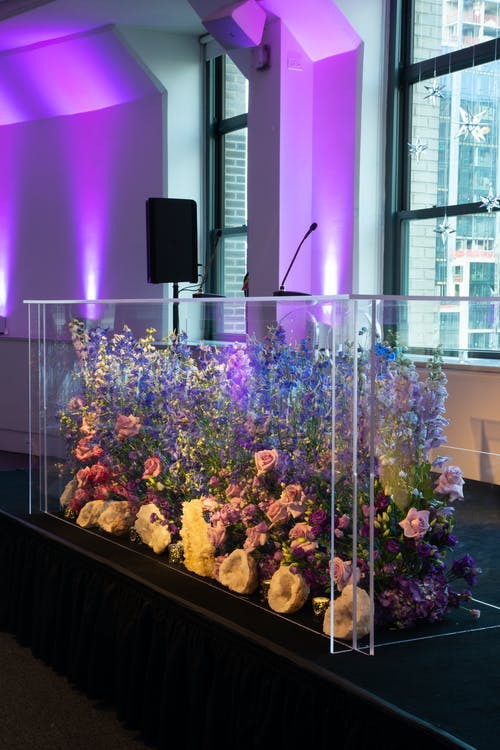 Floral see-through speaking panel at Bat Mitzvah | PartySlate