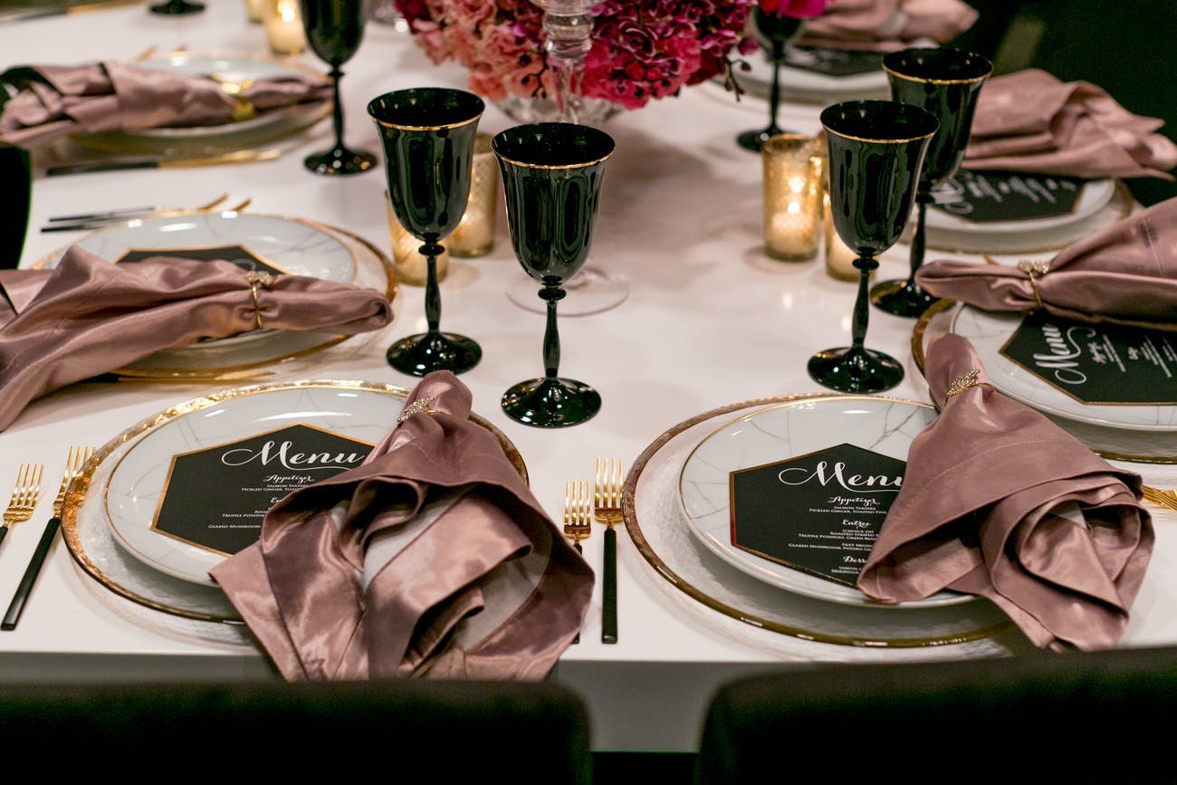 Modern wedding with silk blush pink napkins with black glassware | PartySlate