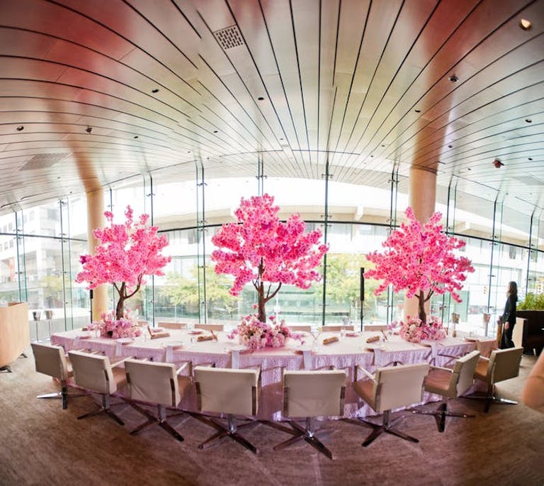 Beautiful pink floral centerpieces at this dreamy mitzvah | PartySlate