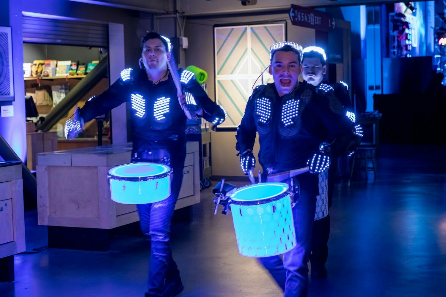 Marching Drummers with Glow-in-the-Dark Blue Drums | PartySlate