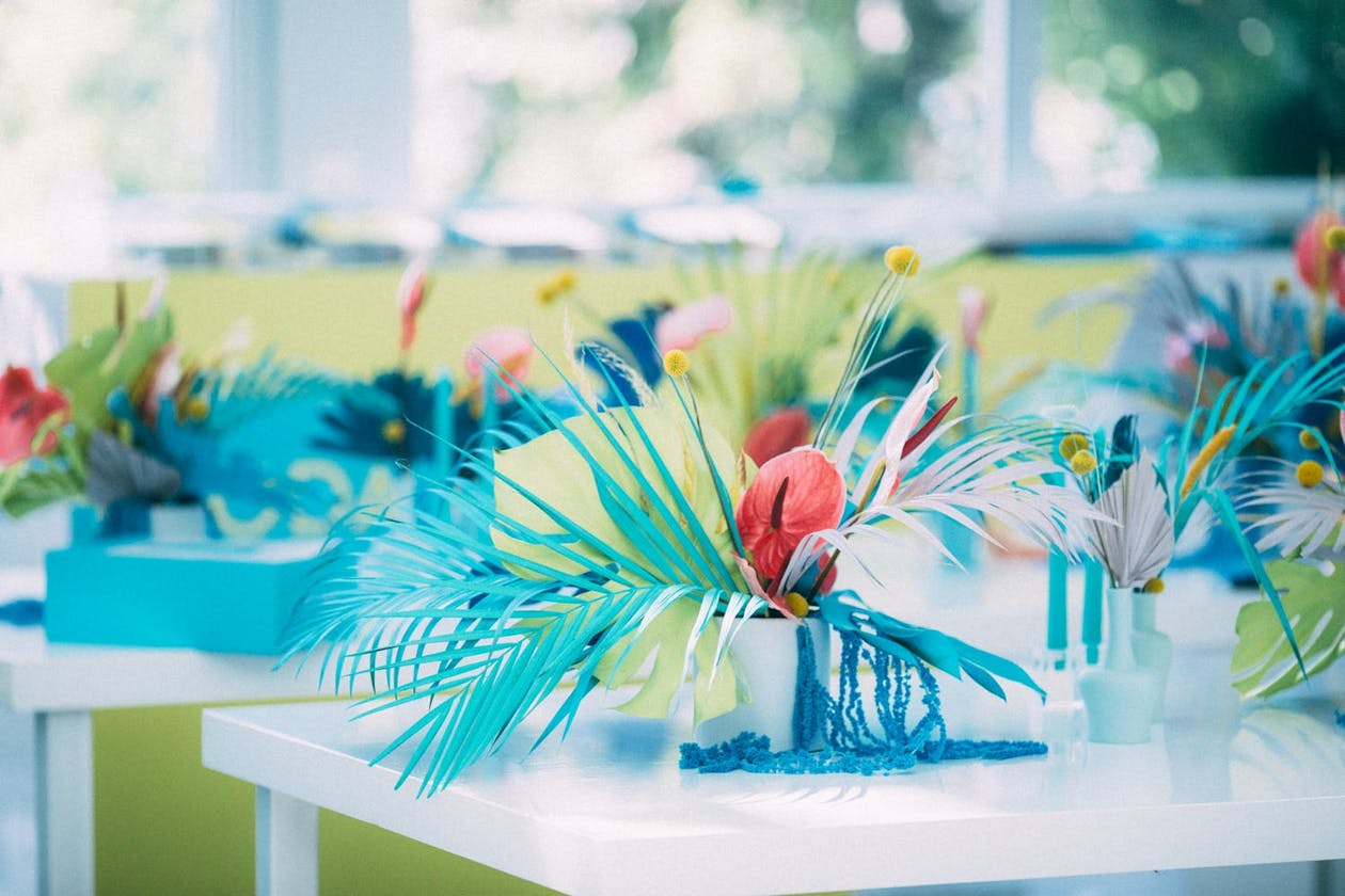 Tropical blue and orange florals at Bar Mitzvah | PartySlate