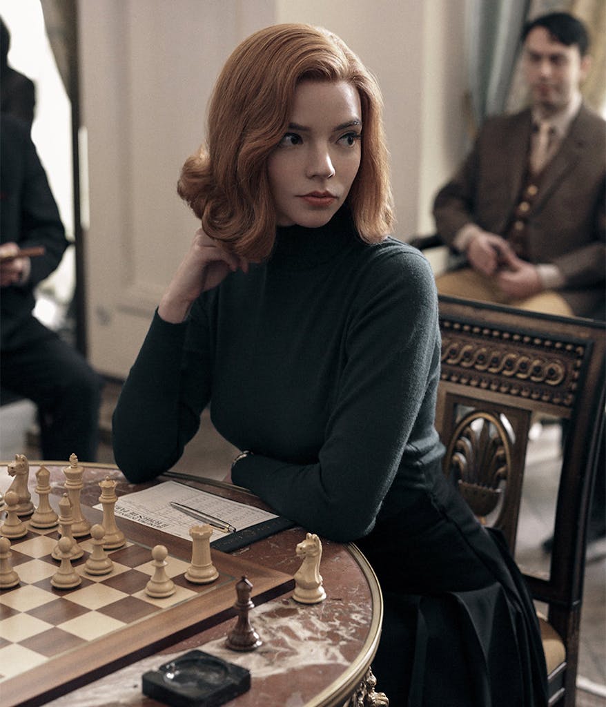 Beth Harmon in front of a chess board from The Queen's Gambit