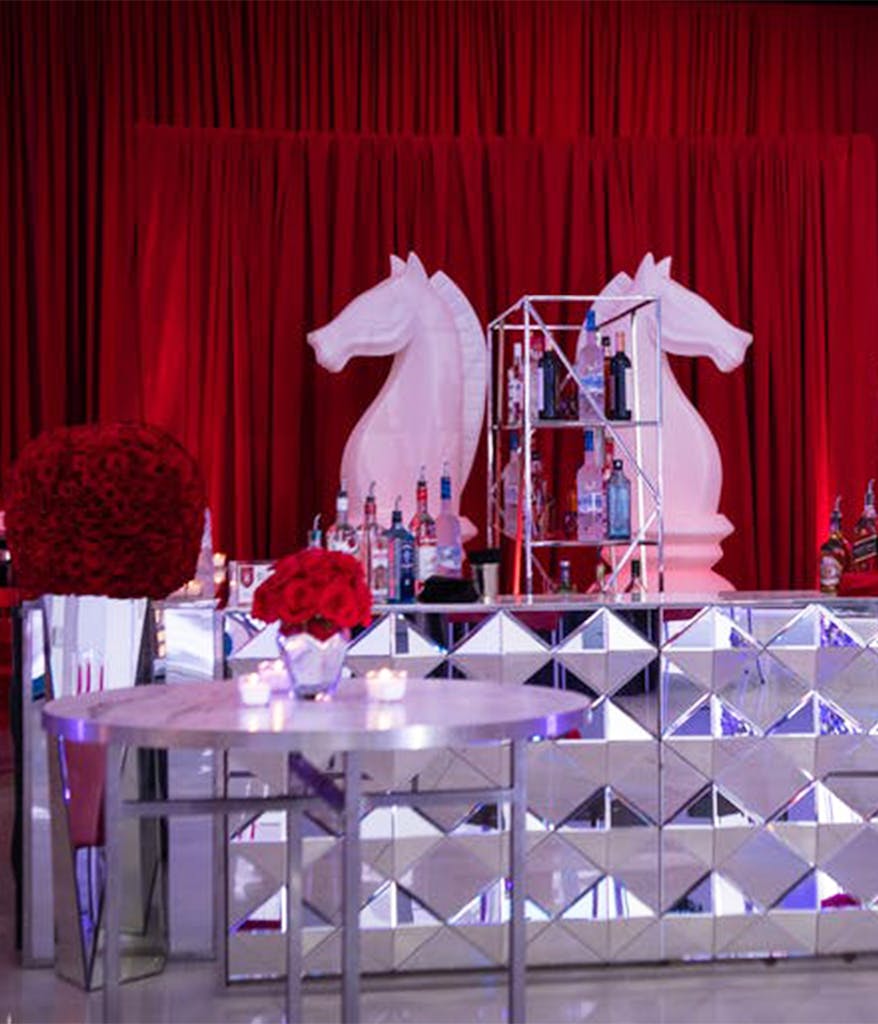 Life size Knight chess pieces as decoration behind a Bar Mitzvah bar