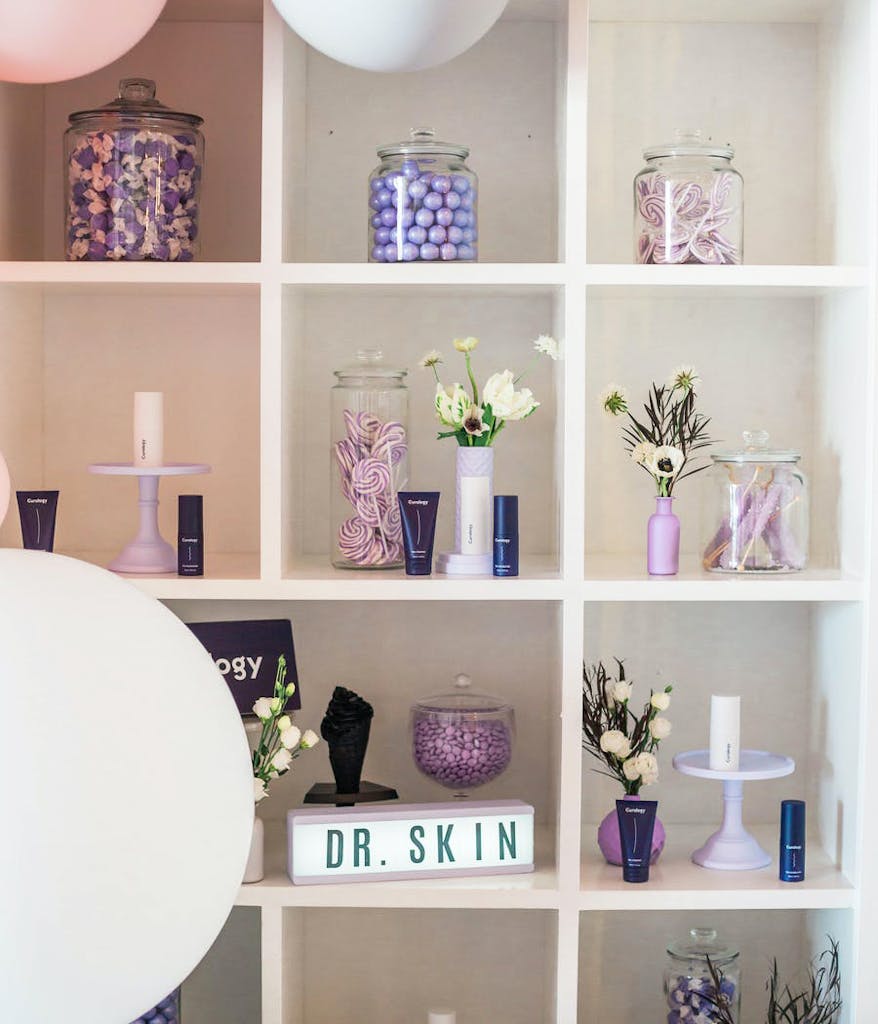shelves with purple products at a skincare launch party