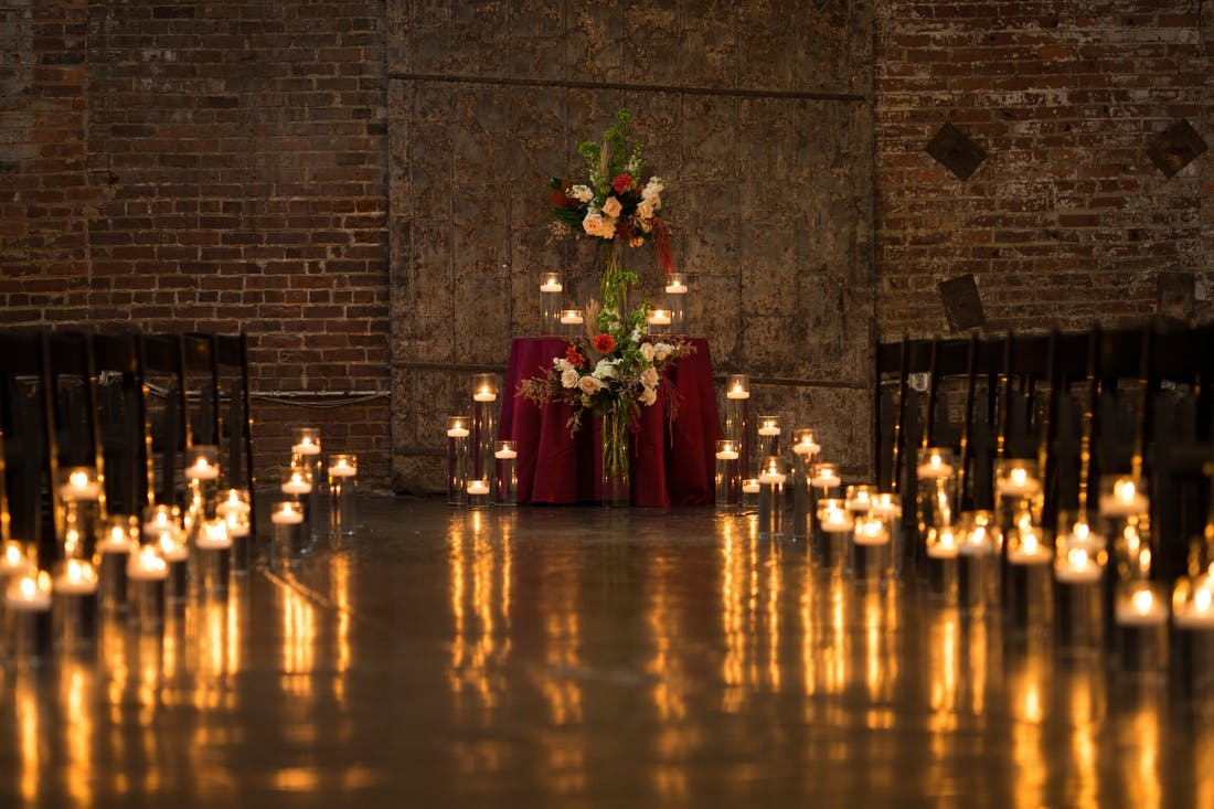 Beautiful candlelight wedding aisle for a micro wedding | PartySlate