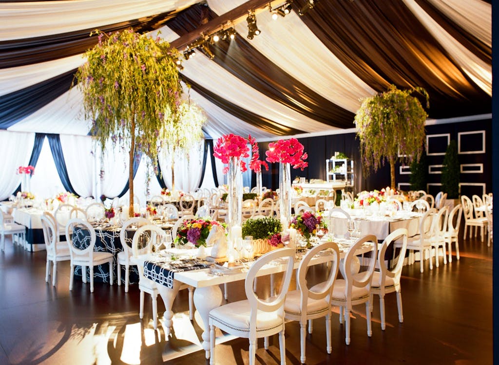 Frame Wedding Tent With Preppy Navy and White Striped Drapery | PartySlate