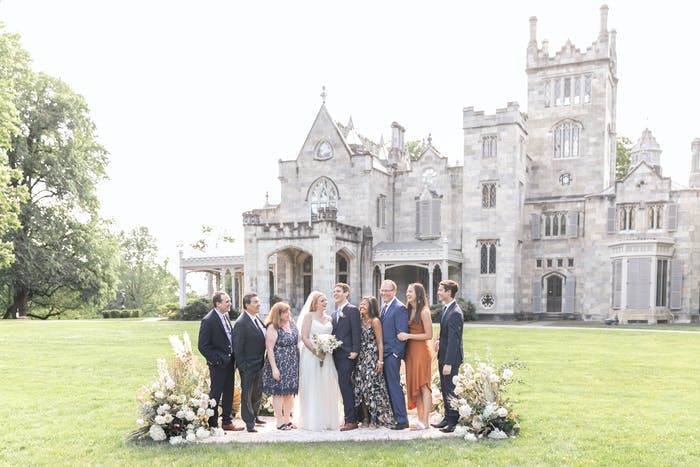An image of a micro wedding right in front of a large castle venue | PartySlate