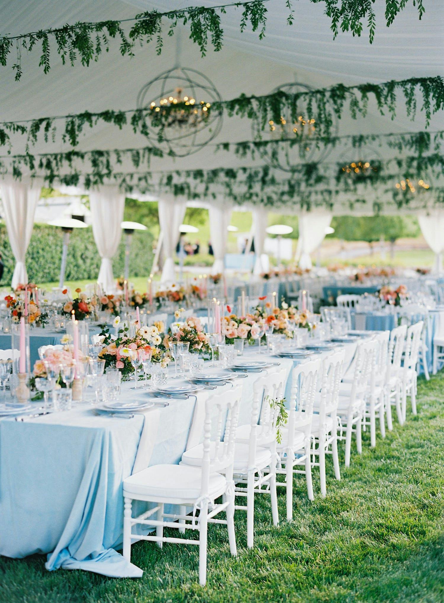 Whimsical Tent Wedding With Blue Linen and Colorful Flowers | PartySlate