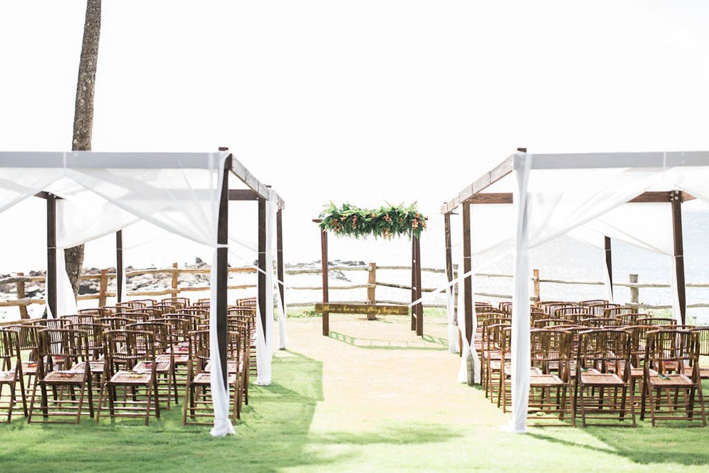 Wedding Ceremony in Hawaii With Two Rows of Cabana-Tented Seating | PartySlate