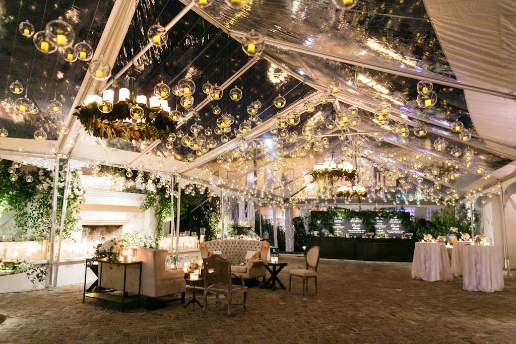 Clear Wedding Tented With Globed Lighting Ceiling Installation | PartySlate