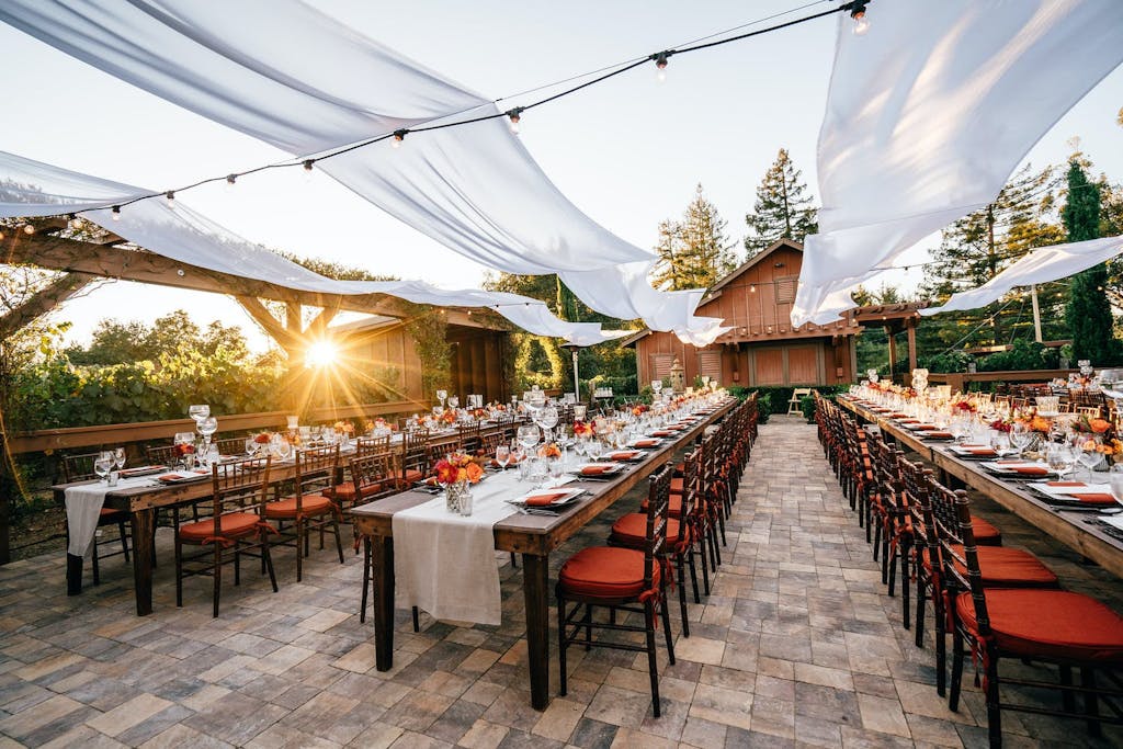 Cabana Style Structure With Open Roof of White Ribboned Drapery | PartySlate