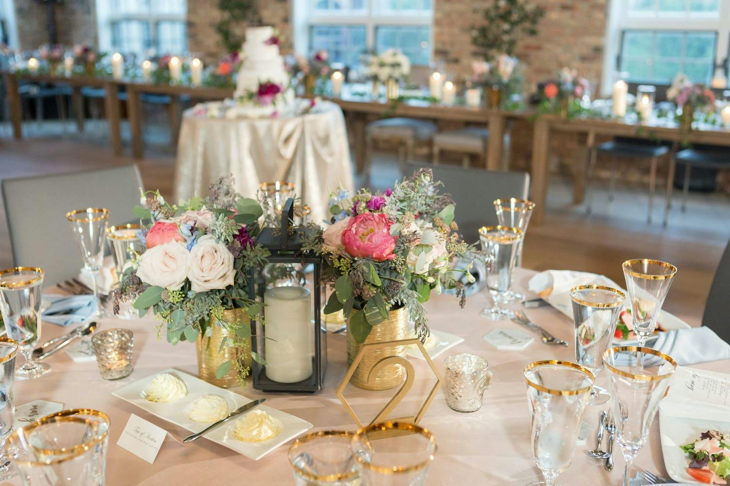 Rustic Wedding Centerpieces With Candlelit Lanterns and Colorful Flowers | PartySlate