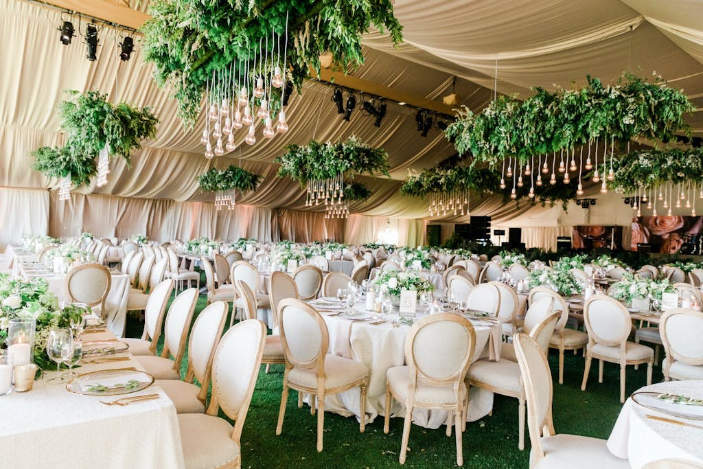 Golden Wedding Tent with Suspended Greenery | PartySlate
