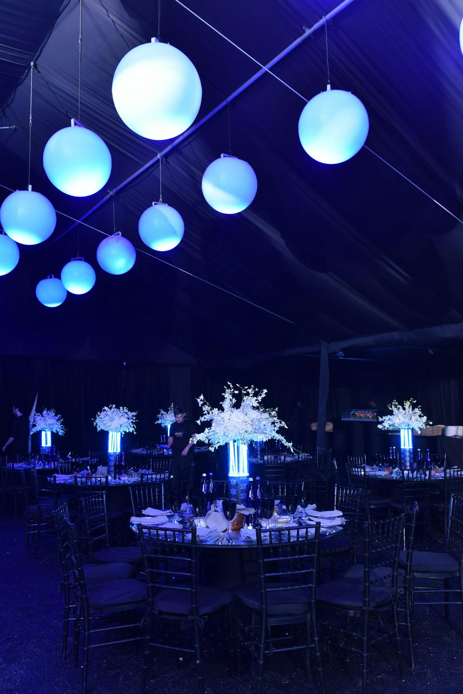 Room lit blue with blue centerpieces
