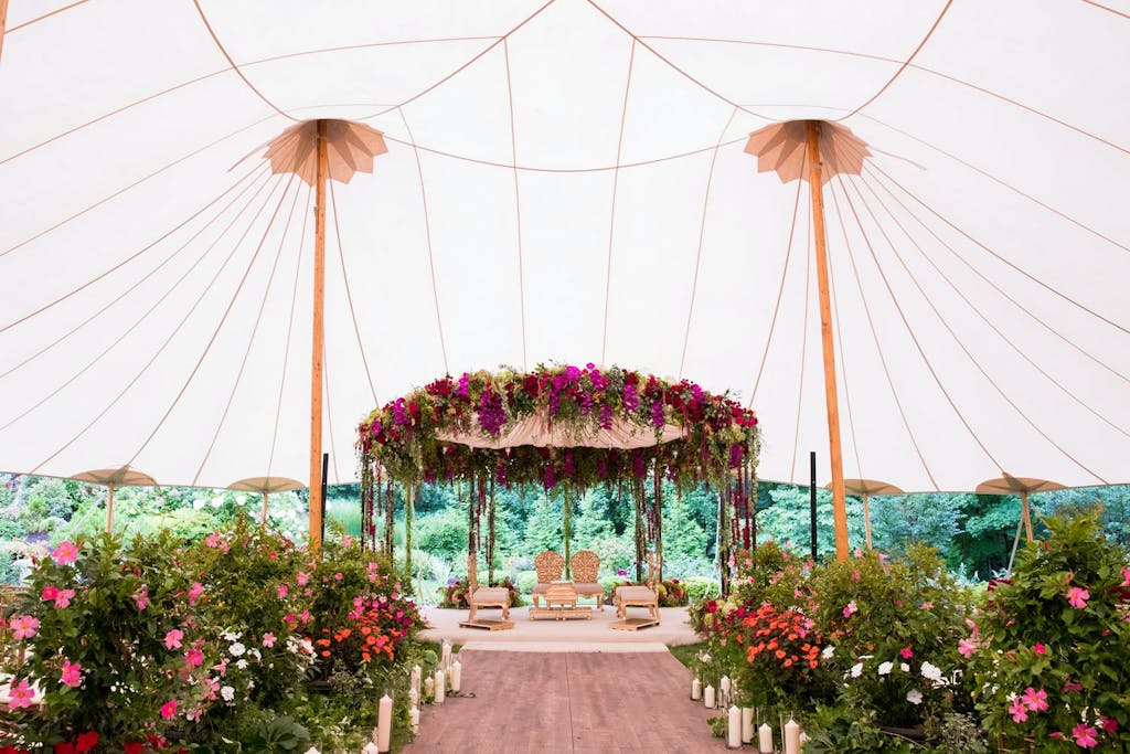 Sailcloth Wedding Tent with Pink Floral Mandap | PartySlate