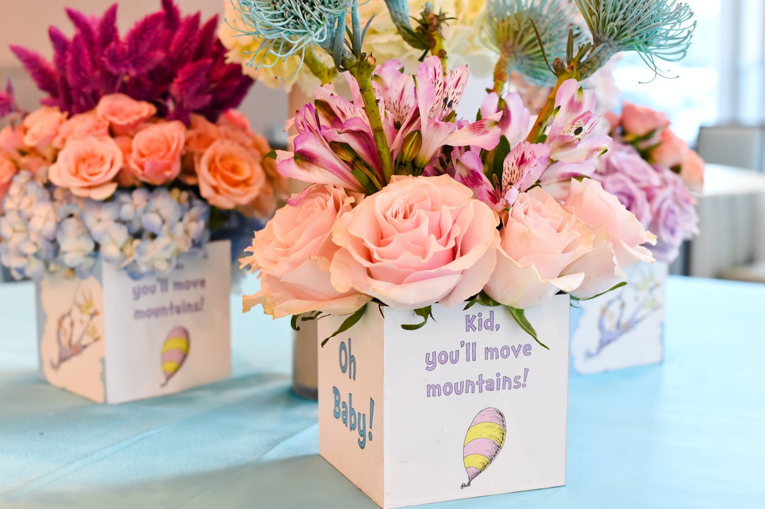Dr. Seuss-Themed Baby Shower Centerpieces With Pink and Peach Flowers | PartySlate
